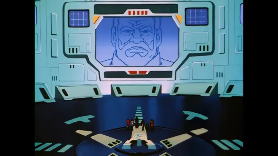 An officer on a comms panel, the frame built around the hardware rather than the face.