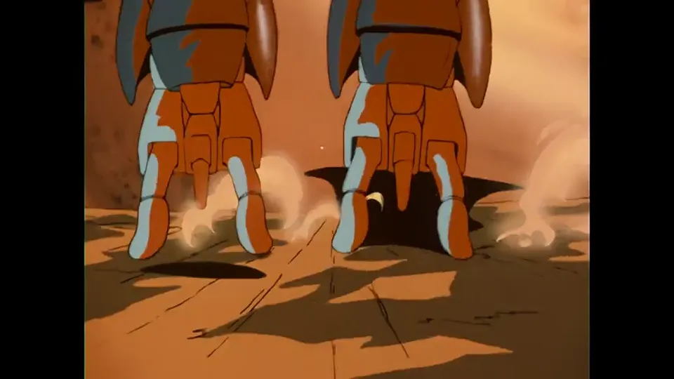 Voltron’s feet hitting sand hard enough to throw dust.