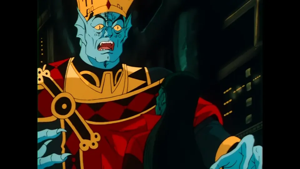 A crowned Drule figure mid-shout, gold collar, red robe.