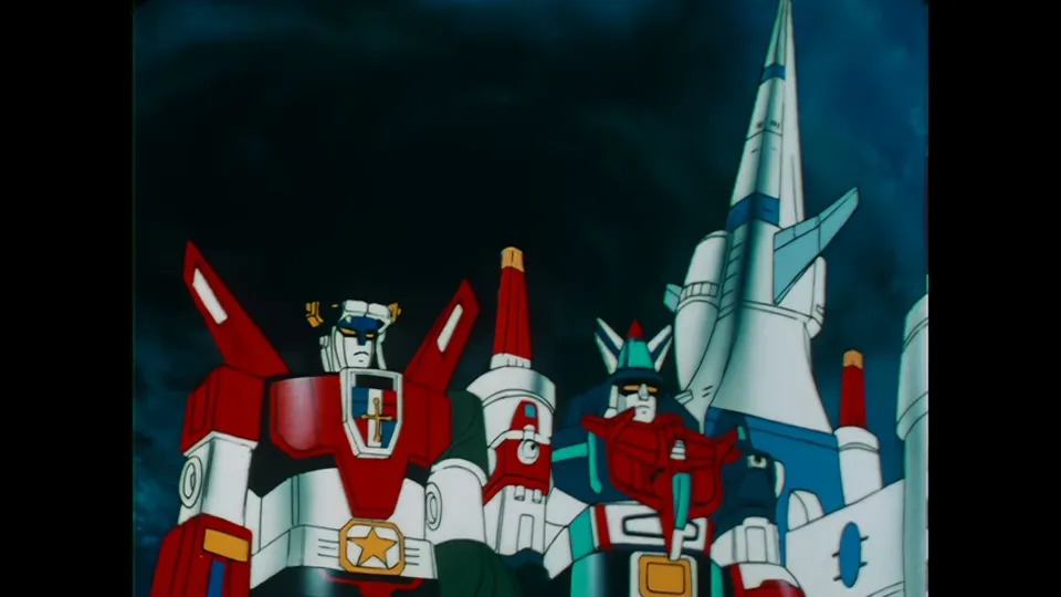 The closing image: both Voltrons standing together in front of the Castle of Lions.